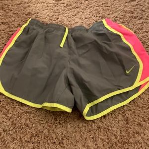 Gray Nike shorts with pink and yellow accent size youth large